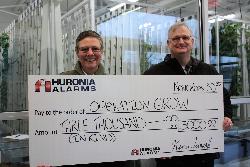 Huronia Alarm & Fire Security Inc. makes donation-in-kind to Operation Grow